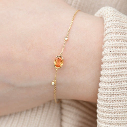 Oval-Shaped Natural Spessartine with Natural Diamond Earrings in 18K Gold