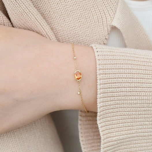 Oval-Shaped Natural Spessartine with Natural Diamond Earrings in 18K Gold