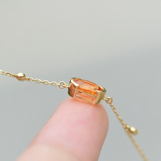 Oval-Shaped Natural Spessartine with Natural Diamond Earrings in 18K Gold