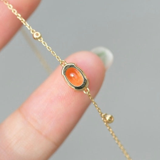 Oval-Shaped Natural Spessartine with Natural Diamond Earrings in 18K Gold