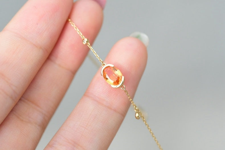Oval-Shaped Natural Spessartine with Natural Diamond Earrings in 18K Yellow Gold